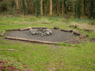 Bonfire spot by a forest, designed with fire safety in mind to minimize risk of forest fire.