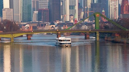 Excursion boat on the river Main in front of Frankfurt Skyline, Germany, on 25th of March, 2018