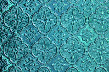 Blue, denim and tiffany background glass. Old vintage glass with an abstract floral and geometric pattern. Design with copy space