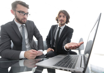 Two businessmen working on a project together