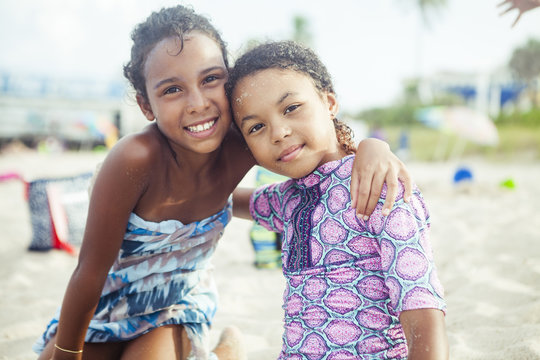 Portrait Of Confident Friends At Beach