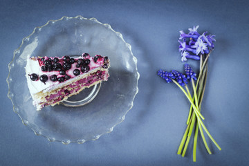 Piece of blueberry cake with hyacinth