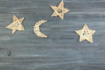 Christmas decoration wooden star with Merry Christmas sign isolated on wooden background. Top view with copy space.