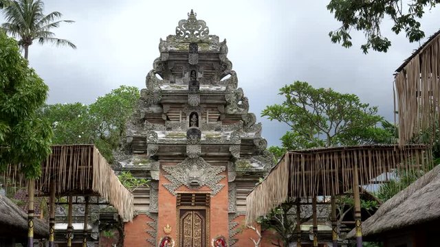 wide shot of the gate to the royal palace, puri saren agung, at ubud in bali, indonesia