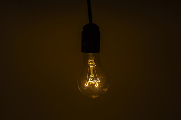 Old vintage bulb light in the dark