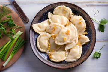 Plate of pierogi or varenyky, vareniki, Dumplings, filled with potato. Pyrohy - dumplings with...