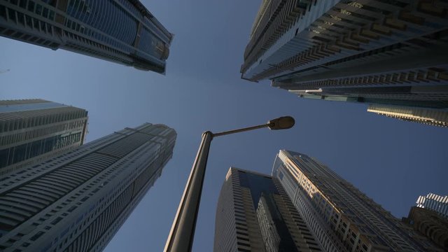 Low angle of a street light and skyscrapers