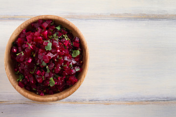 Healthy vegetarian or vegan beetroot, garlic, cilantro and olive oil salad. View from above, top, overhead