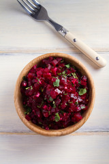 Healthy vegetarian or vegan beetroot, garlic, cilantro and olive oil salad. View from above, top, overhead