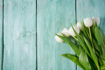 white tulips on turquoise surface