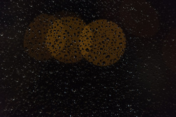 water drops and yellow lights blur up