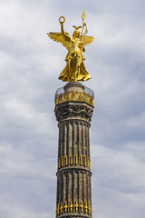 Fototapeta na wymiar Detail of the golden angel of the Siegessaeule (Victory Column) in Berlin, Germany