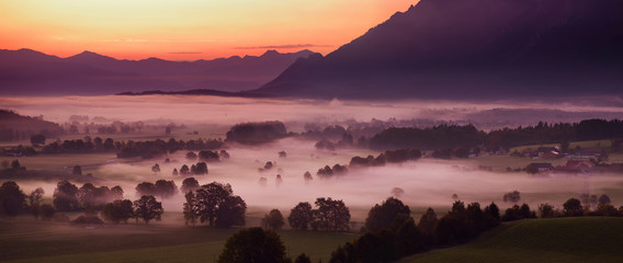 Breathtaking morning lansdcape of small bavarian village covered in fog. Scenic view of Bavarian...