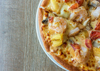 Delicious italian pizza served on wooden table