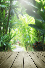 Wooden table and blur garden nature background.