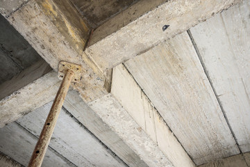 building under construction with iron steel support concrete beams