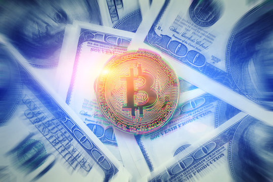 Bitcoin with glitch effect on dollar background, motion blur effect. Golden Bitcoin coin - symbol of crypto currency