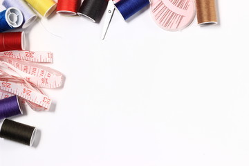 Flat lay or top view, Needle, Scissor, Thread, Tailor Meter, Scissor at White Background