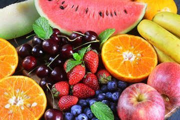 Fresh fruits on wooden background, Healthy diet.