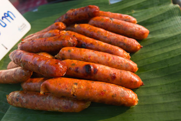 Hot Dogs or SAI AUA ((Notrhern Thai Spicy Sausage) on banana leaf
