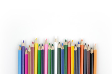 Top view close up multicolored pencils isolated on white background.