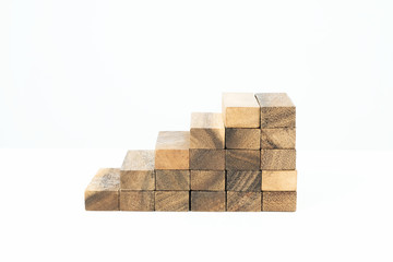 Obraz premium Wood block stacking, Stepping up a toy wood staircase.