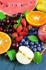 Fresh fruits on wooden background, Healthy diet.