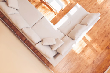 Fototapeta na wymiar White sectional couch in a large luxury interior home