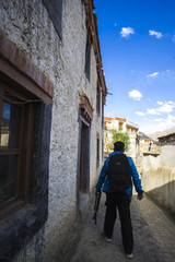 Fototapeta na wymiar Traveler hiking to the top of traditional village in ladakh india.