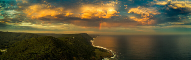 Naklejka premium Rainbow over the Coast
