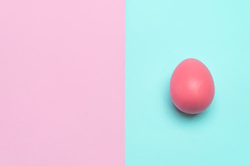 pink easter egg put on punchy pastel background