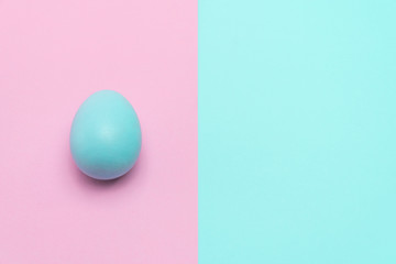 blue easter egg put on punchy pastel background