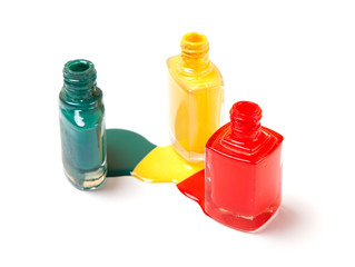 Nail polish three colors, green, yellow and red. white isolated background