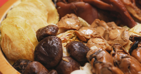 Eating Poon Choi together at home, Chinese cuisine fro lunar new year