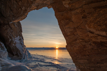 Dawn in the grotto, winter Baikal lake