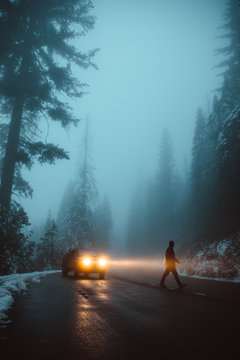 Man crossing road during foggy weather