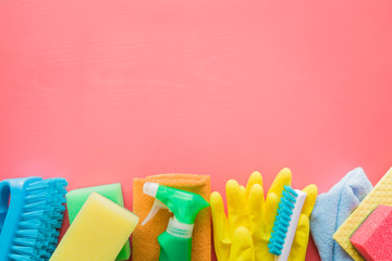 Colorful cleaning set for different surfaces in kitchen, bathroom and other rooms. Empty place for...