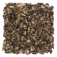 Pile of dry green tea Bilochun snail isolated on white background. Top view from above