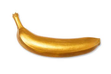 Golden banana isolated on a white background. Creative concept with fruit. View from above, flat lay © Ludaiv