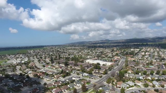 California Neighborhood Flying Rotating - Cumulus clouds and homes give movement to a subtle parallax effect