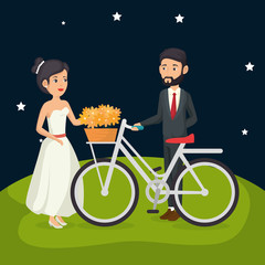 just married couple in the field with bicycle