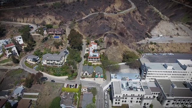 Aerial Flyover - Downtown Ventura - hillside view of city hall and apartments - flying forward