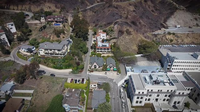 Aerial Flyover - Downtown Ventura - hillside view of city hall and apartments - flying sideways