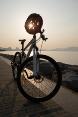 mountain bike with helmet on sunrise coast