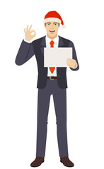 Businessman in Santa hat showing a a paper and  show a okay hand sign
