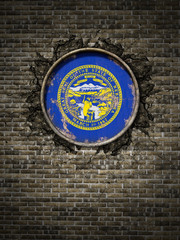 Old Nebraska flag in brick wall