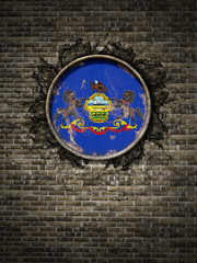 Old Pennsylvania flag in brick wall