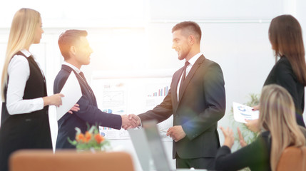 handshake business partners before a business presentation.