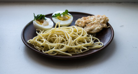pasta with meat and greens and eggs with sauce