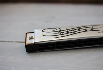 harmonica on wooden background